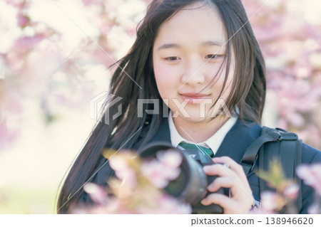 A high school girl captures memories with her SLR camera. A high school girl captures memories with her SLR camera. 138946620