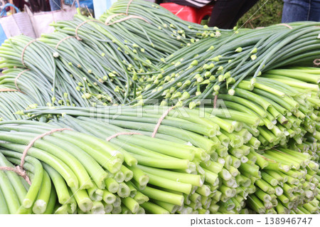 onion leaf bundle on shop for sell, harvest are cash crops onion leaf bundle on shop for sell, harvest are cash crops 138946747