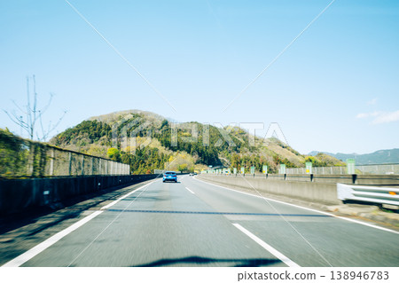 Driving on the highway and spring scenery (film-like style) Driving on the highway and spring scenery (film-like style) 138946783