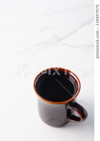 Mug with freshly brewed coffee Mug with freshly brewed coffee 138947078