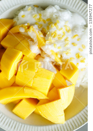 Delicious Mango sticky rice, Thai dessert from sticky rice, ripe mango, coconut milk. Delicious Mango sticky rice, Thai dessert from sticky rice, ripe mango, coconut milk. 138947277