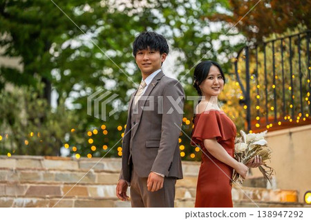 Bride and groom in colored dresses, night wedding, wedding image 138947292