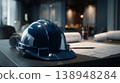 Construction site work with a blue hard hat on a desk with plans and tools during daylight hours in an office space 138948284