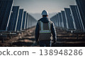 Worker inspects solar panels in a field during daytime at a renewable energy site 138948286