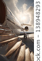 Luxury jet stands ready for departure at the airport under a sunny sky with clouds in the background 138948293