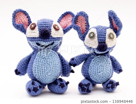 Knitted wool aliens on a white background Knitted wool aliens on a white background 138948446