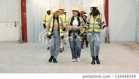 Engineering group, manager walking and warehouse inspection, teamwork and talking of project management. Industrial people, leader or women with discussion for architecture or construction building Engineering group, manager walking and warehouse inspection, teamwork and talking of project management. Industrial people, leader or women with discussion for architecture or construction building 138948549