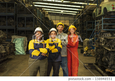 Group of mix multiracial race engineer working together at factory car part warehouse. Group of mix multiracial race engineer working together at factory car part warehouse. 138948551