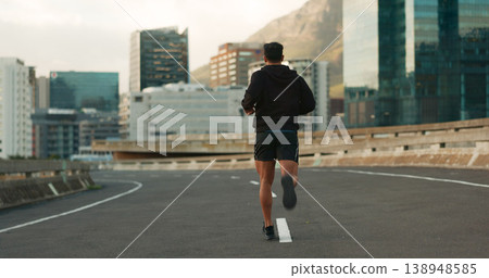 Sports, back and running in morning on city, street and bridge for fitness, workout and marathon training. Athlete, man or exercise on South Africa road for wellness, health or triathlon performance Sports, back and running in morning on city, street and bridge for fitness, workout and marathon training. Athlete, man or exercise on South Africa road for wellness, health or triathlon performance 138948585