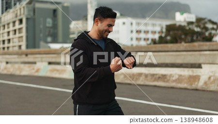 City, runner and man with a smart watch, exercise and fitness with celebration, progress and wellness. Person, guy and athlete with a challenge, training and achievement with digital app and workout City, runner and man with a smart watch, exercise and fitness with celebration, progress and wellness. Person, guy and athlete with a challenge, training and achievement with digital app and workout 138948608
