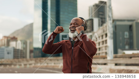 Fitness, excited and senior man, headphones, city and achievement with workout, streaming music and radio. African person, pensioner and runner with headset, progress and exercise wellness or outdoor Fitness, excited and senior man, headphones, city and achievement with workout, streaming music and radio. African person, pensioner and runner with headset, progress and exercise wellness or outdoor 138948658