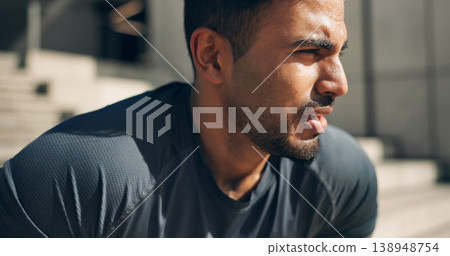 Face, fitness and a tired sports man outdoor in the city for commitment to health or wellness. Fatigue, breathing and sweating with an exhausted young athlete in an urban town for exercise training 138948754