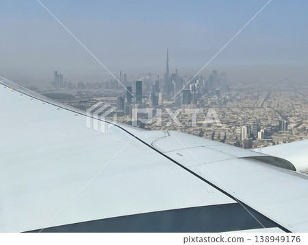 A view of the Dubai cityscape from inside the plane shortly after takeoff from Dubai Airport. 138949176
