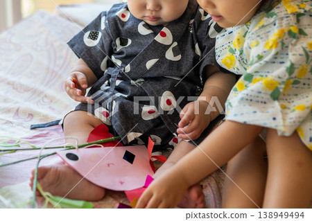 Children playing while making Tanabata decorations. Children playing while making Tanabata decorations. 138949494