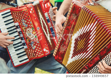 Close-Up of Red Accordion Players in Folk Performance Close-Up of Red Accordion Players in Folk Performance 138949657