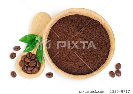 ground coffee in wooden bowl and coffee beans in wooden spoon isolated on white background. Top view. Flat lay 138949717