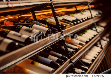 Warm glowing wine rack in cellar Warm glowing wine rack in cellar 138949799