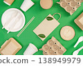 Eco friendly packaging materials on green background 138949979