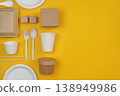 Sustainable tableware set on yellow background 138949986
