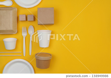 Sustainable tableware set on yellow background 138949986