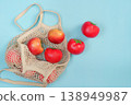 Sustainable shopping with reusable bag and fresh tomatoes 138949987