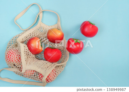 Sustainable shopping with reusable bag and fresh tomatoes Sustainable shopping with reusable bag and fresh tomatoes 138949987