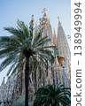 Sagrada Familia basilica with palm trees and blue sky in Barcelona Spain 138949994