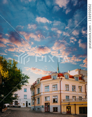Historic corner building in Tallinn Old Town at sunset 138950002