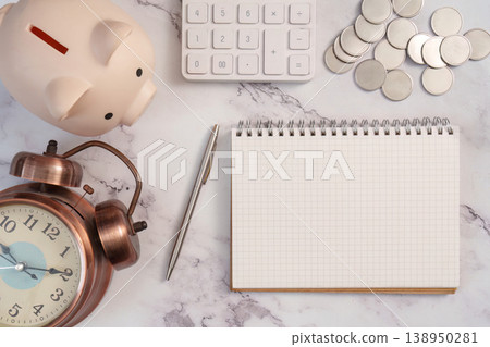 Financial planning tools with piggy bank and notebook 138950281