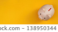 Piggy bank on a vibrant yellow background 138950344