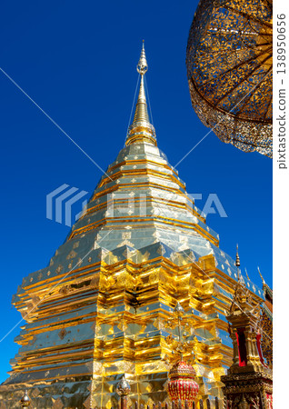 Golden stupa of Wat Phra That Doi Suthep temple in Thailand, richly decorated Buddhist structure with statues and ornate details, spiritual landmark in Chiang Mai 138950656