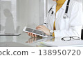 Female doctor using digital tablet, providing modern healthcare and medical technology consultation. Medicine, healthcare and science concept 138950720