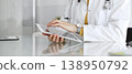 Female doctor using digital tablet, providing modern healthcare and medical technology consultation. Medicine, healthcare and science concept 138950792
