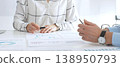 Business meeting with colleagues discussing charts and graphs, analyzing financial reports and strategy plans, teamwork collaboration in modern office setting 138950793