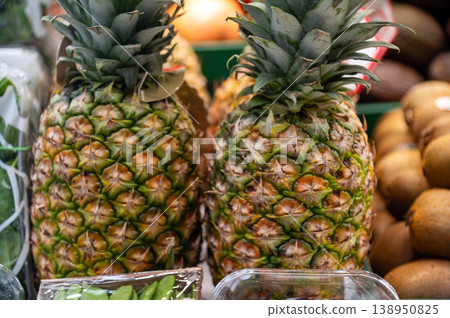 Pineapples and other fruits on display at a market in late afternoon hours Pineapples and other fruits on display at a market in late afternoon hours 138950825