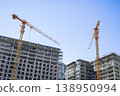 Construction of a building. Construction site with crane. Business, development, industry. 138950994