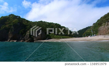 001_Iwate Prefecture: The unusual rock formations of Kitayamazaki and the wake of a small fishing boat sailing across the Pacific Ocean [September] 138951979