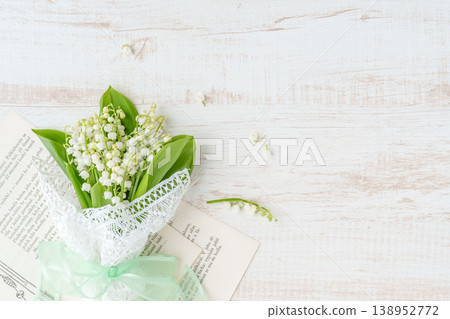 A bouquet of lily of the valley and white lace. 138952772