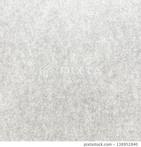 Square background image of the surface of a light white-gray felt-like fibrous sound-absorbing material. 138952840