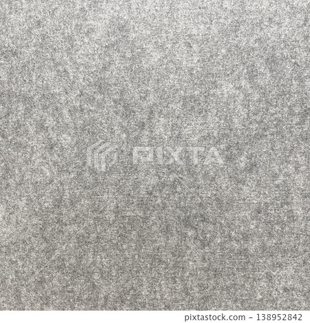 Square background image of the surface of a light gray, felt-like fibrous sound-absorbing material. Square background image of the surface of a light gray, felt-like fibrous sound-absorbing material. 138952842