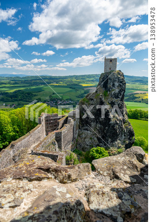 Close up view of the walls and iconic towers of Trosky Castle in Cesky Raj Czech Republic with massive stone structures rising above ruins in summer weather popular tourist destination 138953478