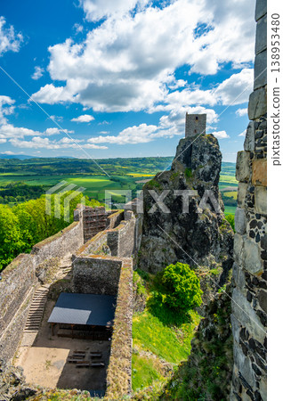 Close up view of the walls and iconic towers of Trosky Castle in Cesky Raj Czech Republic with massive stone structures rising above ruins in summer weather popular tourist destination 138953480