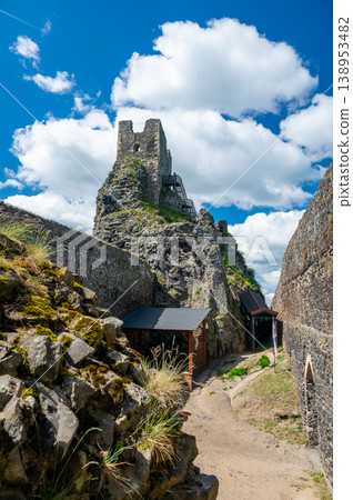 Close up view of the walls and iconic towers of Trosky Castle in Cesky Raj Czech Republic with massive stone structures rising above ruins in summer weather popular tourist destination 138953482