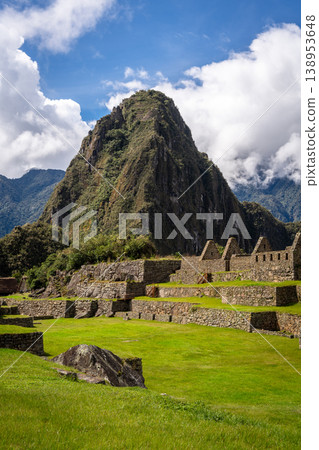 Panoramic view of Machu Picchu ruins with Huayna Picchu in background, Peru Panoramic view of Machu Picchu ruins with Huayna Picchu in background, Peru 138953648