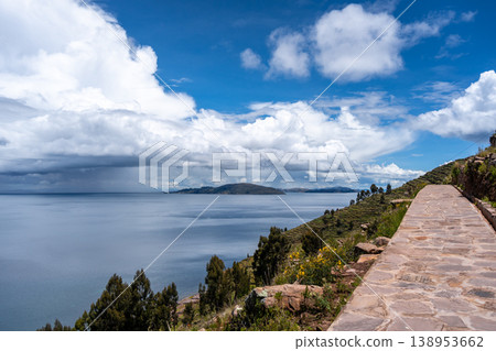 Stone path overlooking nature and terraces on Taquile Island, Lake Titicaca 138953662