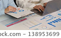 Business professionals analyzing financial data and charts 138953699