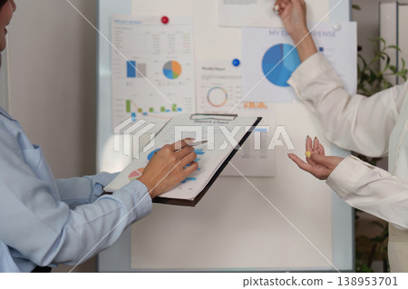 Close-up of professionals analyzing financial charts Close-up of professionals analyzing financial charts 138953701