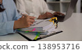 Team reviewing financial documents and reports in office 138953716