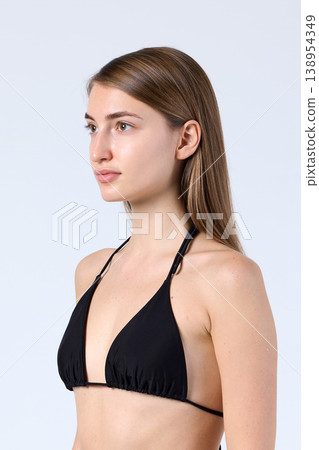 Studio Side Profile Model in Black Halter Bikini Studio Side Profile Model in Black Halter Bikini 138954349