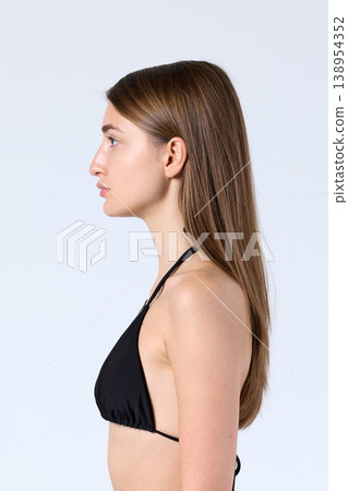 Studio Side Profile Model Looking Forward in Bikini 138954352